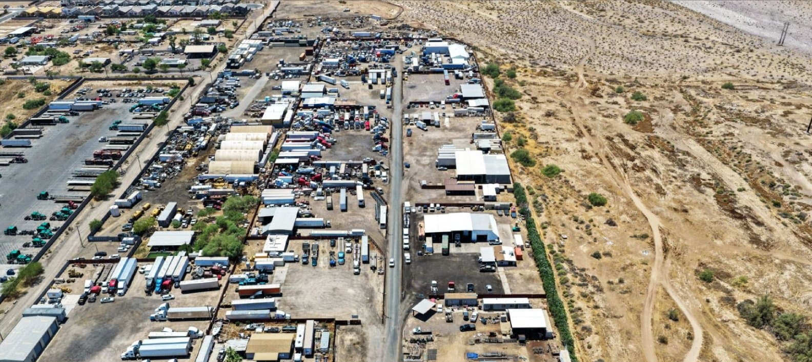 Aerial view of industrial property at 6212 & 6227 S 75th Ave in Phoenix, Arizona showing warehouse improvements, yard area, truck access, and outdoor storage space.