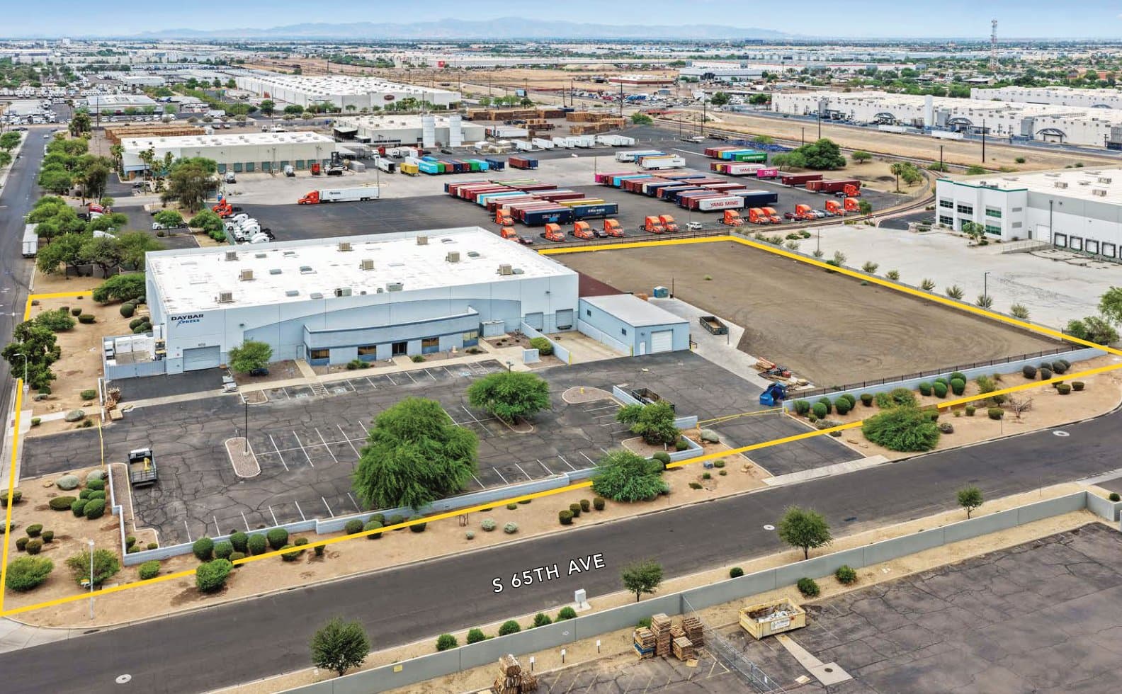 Aerial view of industrial property at 602 S 65th Ave in Phoenix, Arizona showing warehouse building, access points, and surrounding site area.